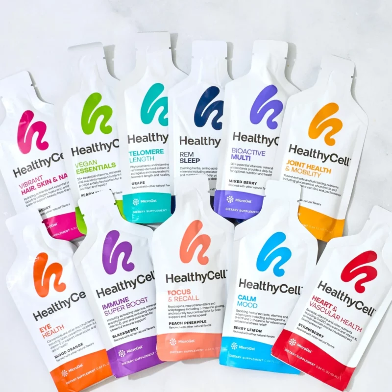 Assorted HealthyCell supplement packets arranged on a light surface